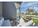 Relaxing outdoor patio with comfortable seating and views of the neighborhood at 6864 Bryant Ct, Denver, CO 80221