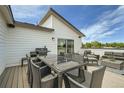 Inviting rooftop deck with outdoor dining and lounge area, perfect for entertaining and enjoying city views at 6864 Bryant Ct, Denver, CO 80221