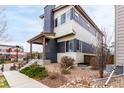Charming two-story home featuring a modern design with a covered porch, and low maintenance landscaping at 9791 Dunning Cir, Highlands Ranch, CO 80126