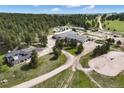 Aerial view of property including acreage, residence and outbuildings at 30886 County Road 17/21, Elizabeth, CO 80107