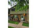 Inviting townhouse with a manicured lawn and a charming entryway at 604 S Xenon Ct, Lakewood, CO 80228
