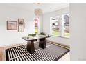 Bright office features a big desk, modern light fixture, three windows that brings in lots of natural light at 1925 W 165Th Way, Broomfield, CO 80023