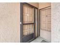 Close-up of unit entrance featuring updated doors and visible unit numbers at 865 S Quebec St # 101B, Denver, CO 80247