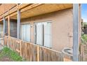 Private outdoor patio area with wood fencing, providing a cozy retreat at 865 S Quebec St # 101B, Denver, CO 80247
