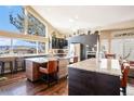 Modern kitchen with granite countertops, stainless steel appliances, and a large window with stunning views at 3336 White Oak Ln, Highlands Ranch, CO 80129