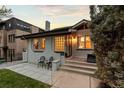 Charming single-story home featuring well-manicured lawn and inviting front patio at 561 Cook St, Denver, CO 80206