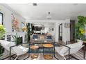An open living room featuring neutral colors, a fireplace, and natural light at 561 Cook St, Denver, CO 80206