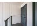 Exterior view of a secure front door with a metal security screen and a sturdy handle at 2150 S Vaughn Way # 302D, Aurora, CO 80014