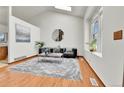 Cozy living room with hardwood floors and a light and airy feel at 5826 S Jebel Way, Centennial, CO 80015