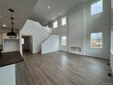 Spacious living area with hardwood floors, high ceilings and an open concept design to kitchen at 2197 S Jackson Gap St, Aurora, CO 80018