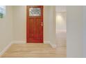 Entryway with hardwood floors, a decorative front door, and neutral paint tones for a modern look at 1275 Fairfax St, Denver, CO 80220