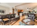 Open living room with a view into the kitchen at 611 E 7Th Ave, Denver, CO 80203