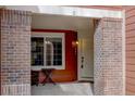 Charming entrance with brick pillars and a cozy seating area at 19414 E Mann Creek Dr # C, Parker, CO 80134