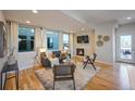 Spacious living room featuring hardwood floors, fireplace, and ample natural light at 2176 S Birch St, Denver, CO 80222