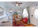 Comfortable living room with hardwood floors, a decorative fireplace and a large window at 1434 Osceola St, Denver, CO 80204