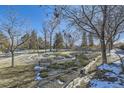 Common area with benches, trees and landscaping at 7725 S Cove Cir, Centennial, CO 80122