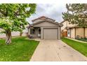 Charming home with a well-manicured lawn and a convenient one car garage at 9328 Fenton Ct, Westminster, CO 80031
