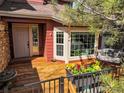 Charming deck with comfortable seating and a flower planter, perfect for outdoor relaxation at 9145 Sugarstone Cir, Highlands Ranch, CO 80130