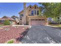 Charming two-story home with a well-manicured front yard and a spacious two car garage at 4560 Flanders Way, Denver, CO 80249