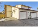 Rear view of the property showing the garage and adjacent units at 1945 W 102Nd Ave, Thornton, CO 80260