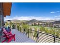 Unwind on the balcony overlooking lush greenery, distant mountains, and a beautiful golf course at 2250 Highlands Dr, Breckenridge, CO 80424