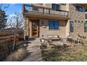 Charming home featuring a mix of stone and stucco, enhanced by a cozy front patio, perfect for relaxing outdoors at 3323 W Hayward Pl, Denver, CO 80211