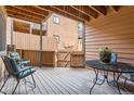 Private back deck with outdoor seating, offering a tranquil space for relaxation and enjoying the outdoors at 9411 W 89Th Cir, Westminster, CO 80021