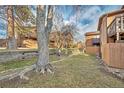 A lovely backyard featuring mature trees and partial fencing for a private outdoor retreat at 9411 W 89Th Cir, Westminster, CO 80021