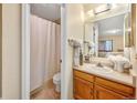 Bathroom featuring a shower and tub combination, a vanity, and good lighting at 9411 W 89Th Cir, Westminster, CO 80021