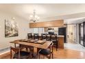 Warm kitchen and dining area featuring a breakfast bar and classic cabinets at 9411 W 89Th Cir, Westminster, CO 80021