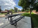 Community playground area with picnic tables for outdoor fun and gatherings at 9411 W 89Th Cir, Westminster, CO 80021