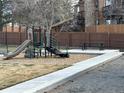The playground features a slide, climbing structure, and picnic table for Gathering fun at 9411 W 89Th Cir, Westminster, CO 80021