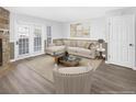 Inviting living room with stone fireplace, comfortable seating, and natural light at 19618 Rosewood Ct, Parker, CO 80138