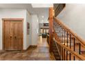 Inviting foyer with wood accents, tile flooring, and a staircase that leads to the upper level at 50 Cooney Ct, Breckenridge, CO 80424