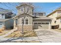 Charming two-story home featuring stone accents, a two-car garage and professional landscaping at 10251 Rifle St, Commerce City, CO 80022