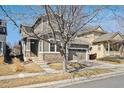 Charming two-story home featuring stone accents, a two-car garage and professional landscaping at 10251 Rifle St, Commerce City, CO 80022