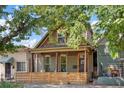 Charming craftsman home with a welcoming porch and modern fenced yard at 3607 Mariposa St, Denver, CO 80211