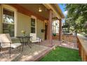 Relaxing front porch with seating area and artificial turf at 3607 Mariposa St, Denver, CO 80211