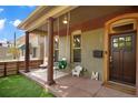 Inviting front porch with seating area, perfect for relaxing at 3607 Mariposa St, Denver, CO 80211