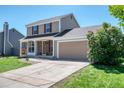 Charming two-story home features a two-car garage, brick accents, well-maintained lawn, and mature landscaping at 714 Sedge Way, Lafayette, CO 80026