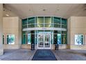 Building entrance featuring a gray mat reading, 