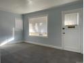 Well lit living room featuring freshly painted walls and carpeted floors at 4445 E Florida Ave, Denver, CO 80222