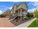 Beautiful two-story home with landscaped front yard and inviting porch at 10102 Yampa Ct, Commerce City, CO 80022