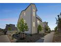 Exterior of a modern, multi-story home with well-maintained landscaping and stylish architectural design at 18211 E 51St Ave, Denver, CO 80249