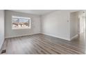 Inviting living room with sleek flooring, large windows, and ample natural light at 3299 S Forest St, Denver, CO 80222
