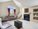Inviting living room with a fireplace, and neutral colored furniture at 1801 S Dunkirk St # 205, Aurora, CO 80017