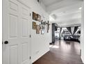 Bright hallway featuring wood floors, leading to a cozy living space at 19155 Robins Dr, Denver, CO 80249