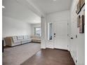 Inviting living room features a spacious sectional sofa and great natural light at 19155 Robins Dr, Denver, CO 80249