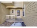 Exterior entry with a covered porch and white trim, showcasing a welcoming entrance at 10329 W Fair Ave # C, Littleton, CO 80127