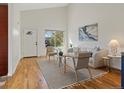 Cozy living room with vaulted ceilings and a view through the front window at 2850 Lowell Blvd, Denver, CO 80211